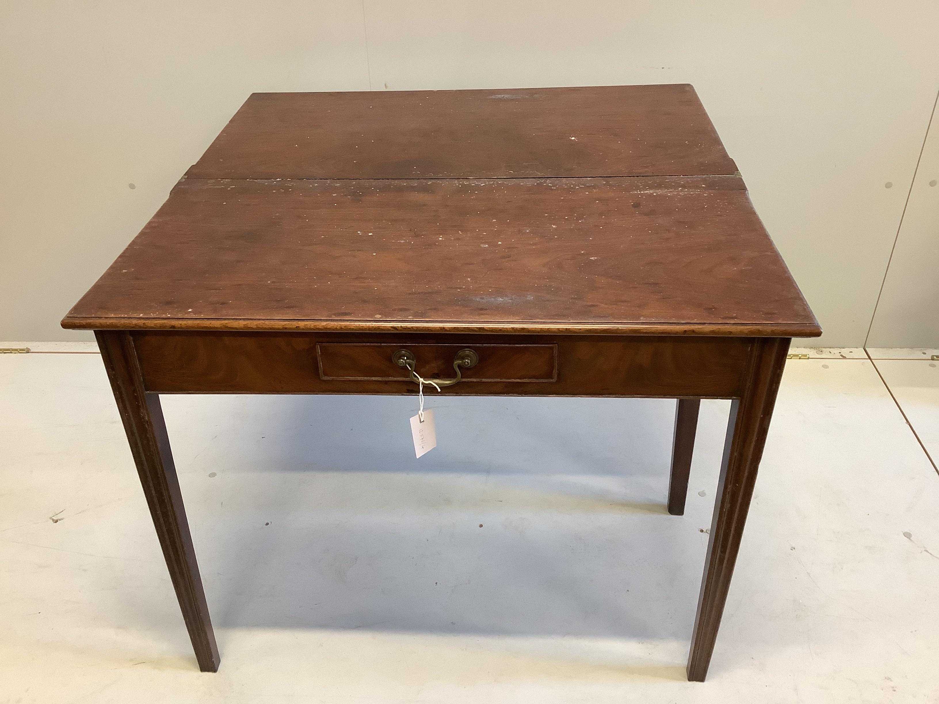 A George III rectangular mahogany folding tea table, width 92cm, depth 45cm, height 73cm